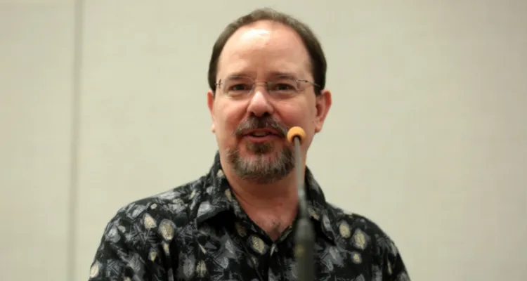 John Scalzi speaking at a conference in 2021