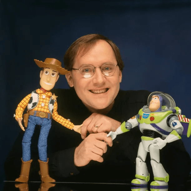 John Lasseter with two of his characters from the film 'Toy Story', Woody and Buzz Lightyear.